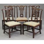 A set of five George III Chippendale period mahogany pierced splat back dining chairs with drop-in