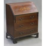 An Edwardian mahogany and inlaid bureau, the fall front above three long drawers, on bracket feet,