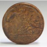 An early 19th century French pressed burr maple circular snuff box, the lid with a titled scene of