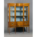 An Edwardian satinwood and floral painted display cabinet, the inverted concave front fitted with