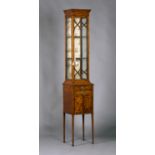 An unusual late Victorian Neoclassical Revival satinwood narrow glazed cabinet with tulipwood