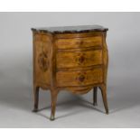 A mid-18th century Italian walnut serpentine fronted commode, the shaped marble top above four