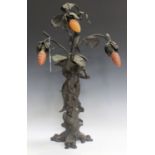 An Art Nouveau style patinated spelter table light, the figural stem in the form of a maiden with an