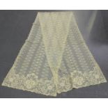 An early 20th century ivory-toned lacework stole, 225cm x 51cm, together with a small group of other