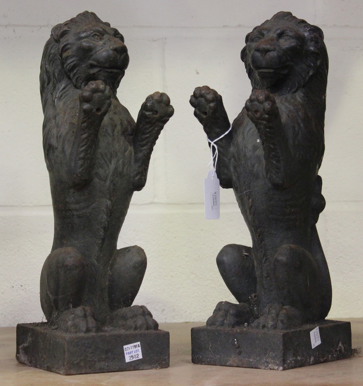 A pair of 20th century heavy cast iron models of lions rampant, height 36cm.Buyer’s Premium 29.4% (