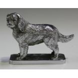 A cast metal chromium plated car mascot in the form of a spaniel, the underside marked 'Lejeune Made