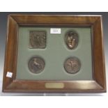 Enzo Plazzotta - four late 20th century brown patinated cast bronze medallions, comprising 'Leonardo