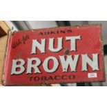 A double-sided 'Adkin's Nut Brown Tobacco' enamelled advertising wall sign, 30.5cm x 47cm.Buyer’s