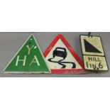 A 'YHA' green enamelled triangular sign, height 60cm, together with two road signs.Buyer’s Premium