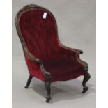 A Victorian mahogany showframe lady's salon chair with carved scroll and foliate decoration,