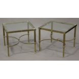 A pair of mid-20th century gilt brass square occasional tables, inset with glass tops, raised on