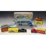 Four Dinky Toys vehicles, comprising a No. 255 Mersey Tunnel Police Van, a No. 256 Police Patrol