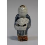 A rare Japanese Hirado porcelain netsuke rattle, Edo period, modelled as a Chinese boy holding a
