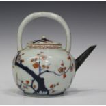 A Japanese Imari porcelain teapot and cover, early 18th century, the bulbous body painted with