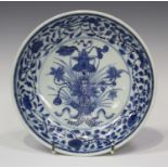 A Chinese blue and white Ming style lotus bouquet saucer dish, Yongzheng period, the centre