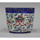 A Chinese Canton enamel wine cup, Qing dynasty, the exterior painted in the famille rose palette