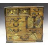 A Japanese lacquered and parquetry inlaid table-top cabinet, Meiji period, with engraved copper