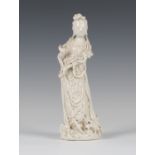 A Chinese blanc-de-Chine porcelain figure of Guanyin, Qing dynasty, with attractively detailed