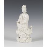 A Chinese blanc-de-Chine porcelain figure of Guanyin, Qing dynasty, probably Kangxi period, with