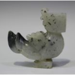 A Chinese zoomorphic jade carving, Qing dynasty, modelled as a bird with carved and incised