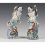 A pair of Chinese famille rose enamelled export porcelain figure groups of Liu Hai and his three