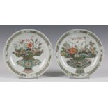 A pair of Chinese famille verte porcelain saucer dishes, Kangxi period, each centre painted with a