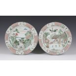 A pair of Chinese famille verte porcelain circular dishes, Kangxi period, each centre painted with a