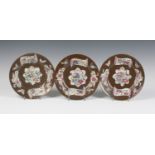 A set of three Chinese famille rose café-au-lait ground export porcelain plates, Qianlong period,