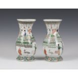 A pair of Chinese famille verte export porcelain wall vases, Kangxi period, each of baluster form