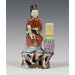 A Chinese famille rose enamelled export porcelain jostick holder figure, Qianlong period, modelled