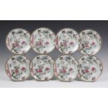 A set of eight Chinese famille rose export porcelain plates, Yongzheng period, each enamelled with a