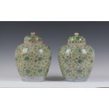 A near pair of Chinese yellow ground porcelain ginger jars and covers, Qing dynasty, probably Kangxi