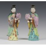 A pair of Chinese famille rose export porcelain candle holder figures of ladies, Qianlong period,