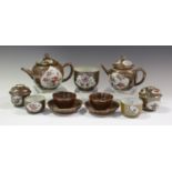 A group of Chinese café-au-lait glazed porcelain teaware, Qianlong period, comprising a pair of