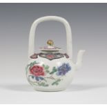 A Chinese famille rose export porcelain teapot and matched cover, of globular form with overhead