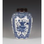 A Chinese blue and white porcelain jar, Kangxi period, of ovoid form, painted with four panels of