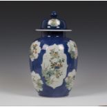 A Chinese famille verte powder blue ground porcelain jar and domed cover, Kangxi period, of