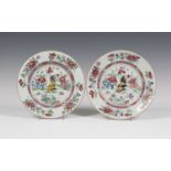 A pair of Chinese famille rose export porcelain plates, Yongzheng period, each enamelled with a