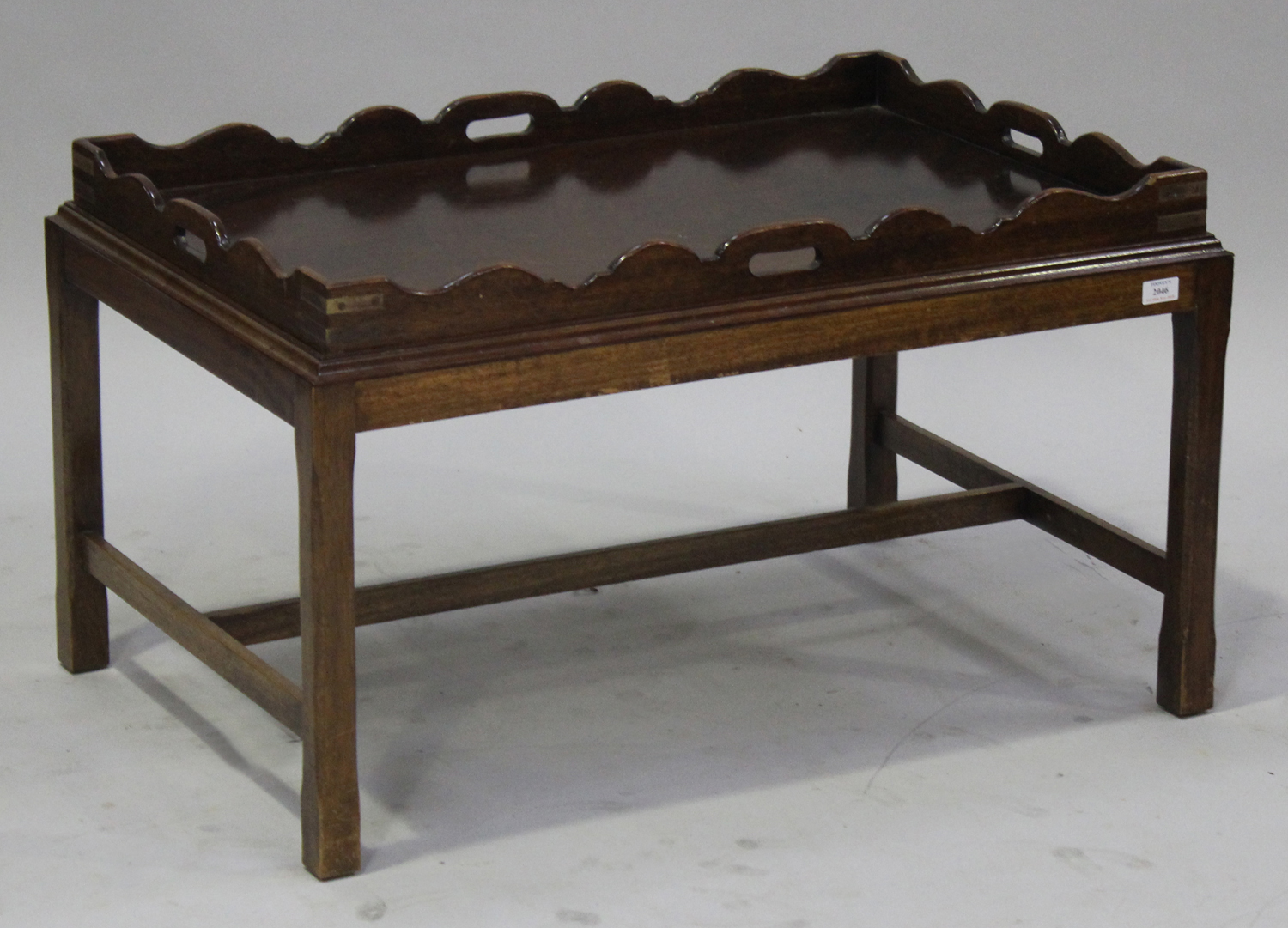 A late 20th century mahogany campaign style butler's tray with pierced handles and brass recessed