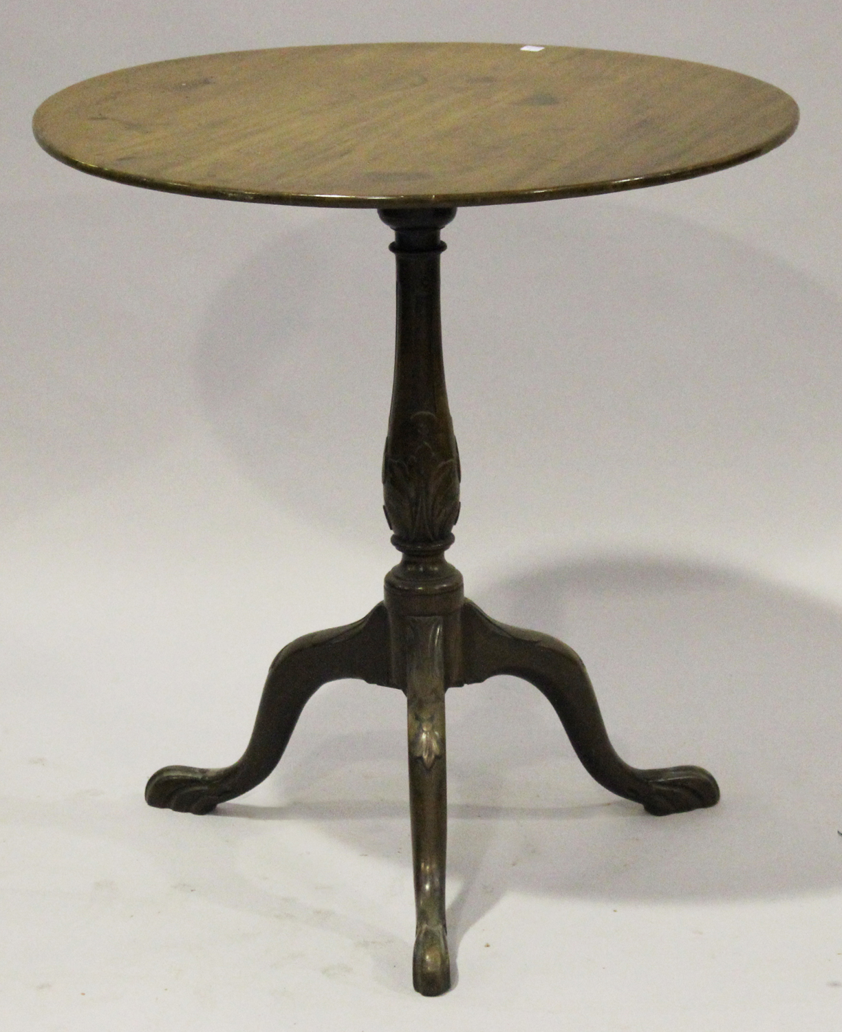 A George III and later carved mahogany tip-top wine table, raised on tripod legs, height 69.5cm,