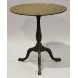 A George III and later carved mahogany tip-top wine table, raised on tripod legs, height 69.5cm,