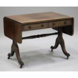 A Regency rosewood sofa table with brass inlay, fitted with two frieze drawers, raised on reeded