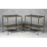 A pair of early 20th century gilt brass two-tier étagères with pineapple finials and barrel castors,