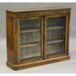 A Victorian walnut and ebonized pier cabinet with inlaid decoration and gilt metal mounts, fitted