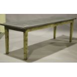 A 20th century pine utility farmhouse table, the long rectangular top covered in zinc, raised on