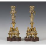 A pair of early 19th century fluorspar and cast ormolu mounted candlesticks, each turned sconce