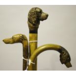 A late 20th century walking stick, the softwood handle carved as a spaniel's head with inset glass