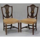 A set of six 20th century George III style mahogany pierced splat back dining chairs, the backs