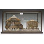 A late 19th/early 20th century Swiss Black Forest softwood diorama of an alpine chalet and barn,