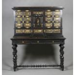 A 19th century Continental ebonized and gilt metal mounted collector's cabinet, the top surmount